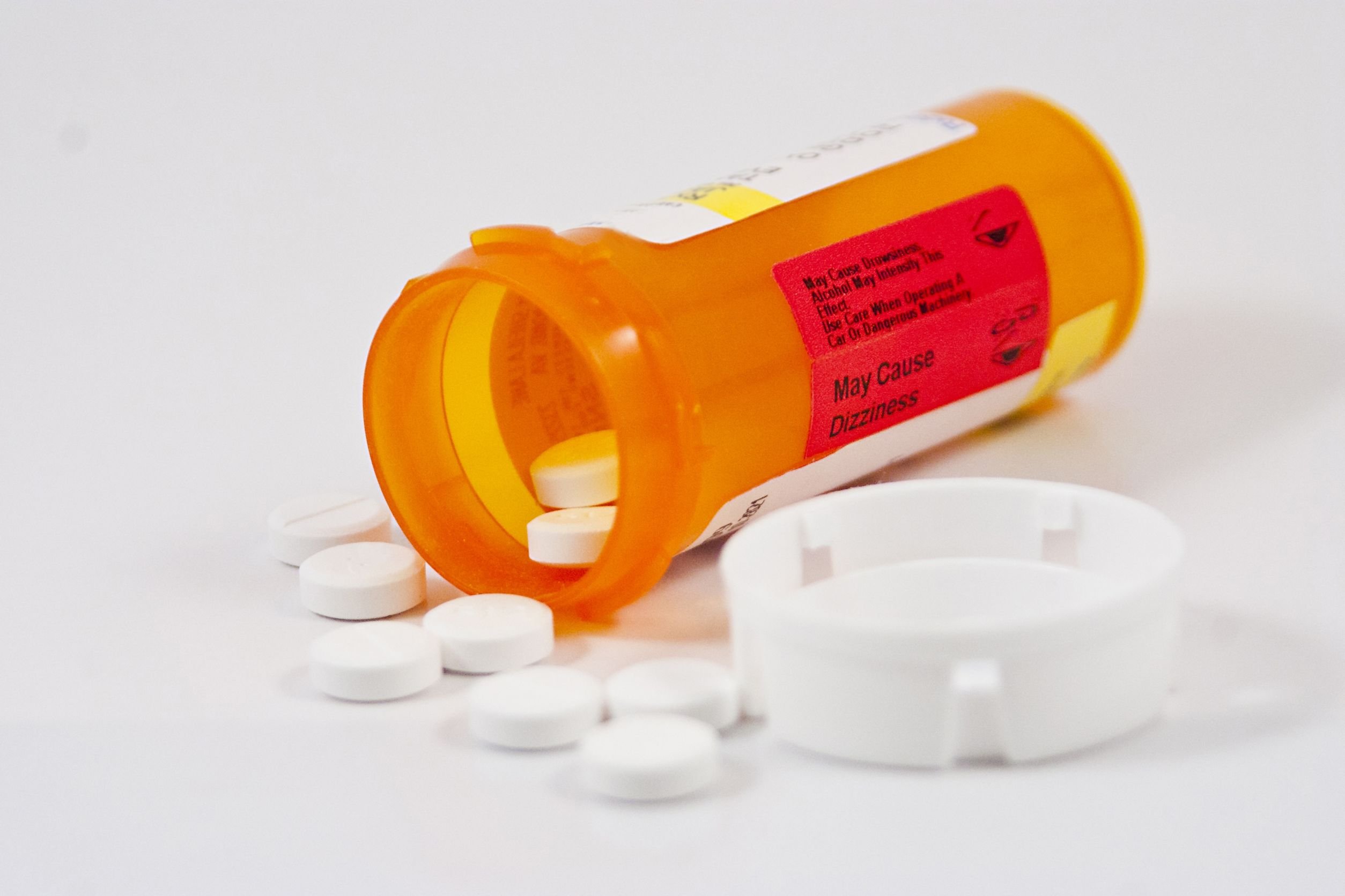 pill bottle with pills coming out
