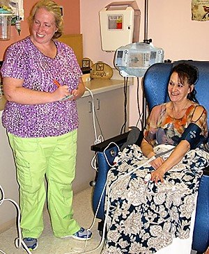 Regina Holmberg sits in infusion therapy