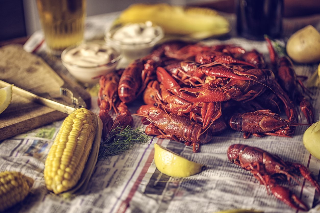 Entertaining Creole Style How To Host The Perfect Crawfish Boil Down Home Serving Style Is Poured Onto A Communal Table Covered With Newspaper Or Disposable Cover For All The Guests To Plunder
